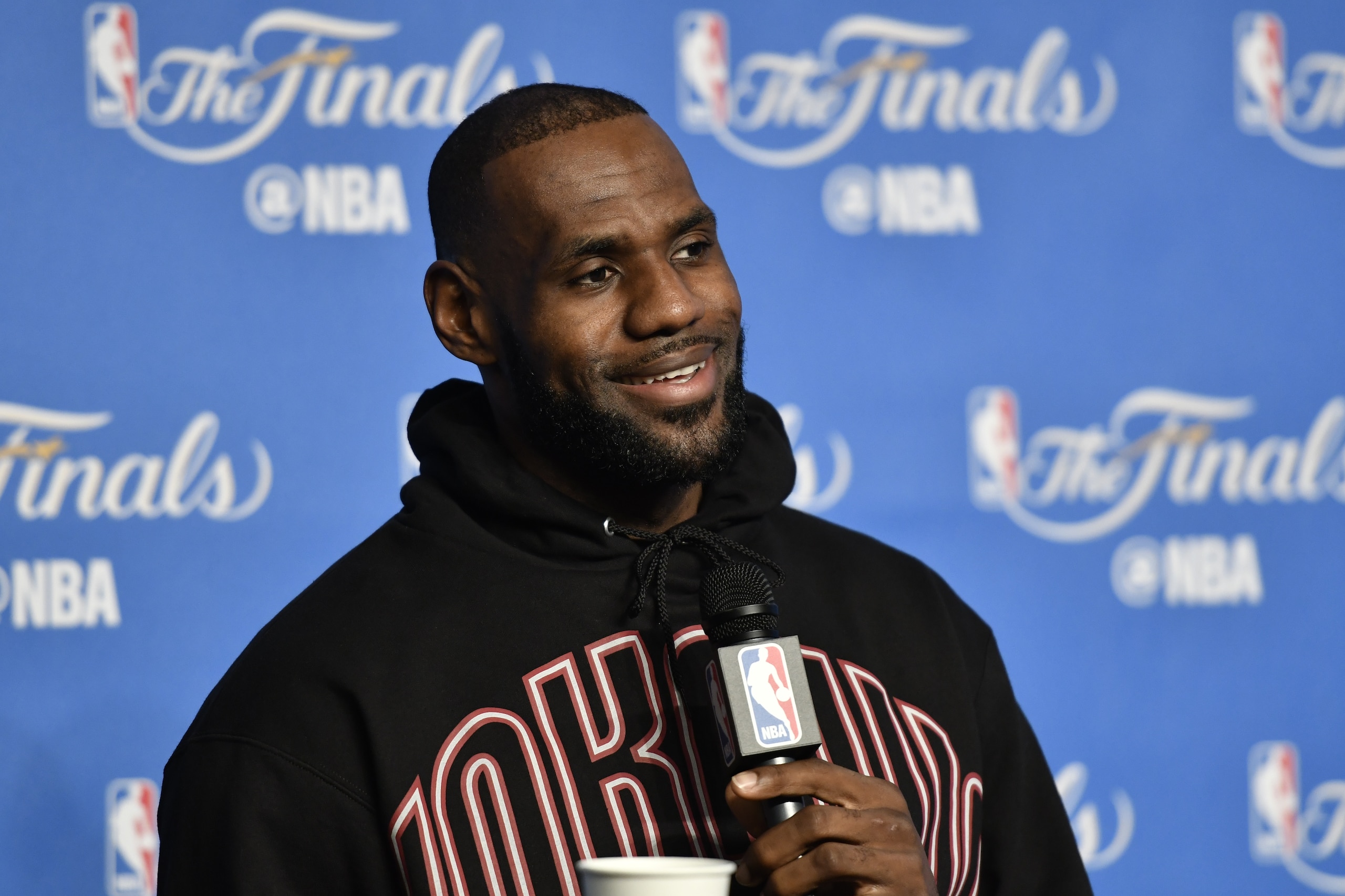 CLEVELAND, OH - JUNE 08:  LeBron James #23 of the Cleveland Cavaliers talks to the media during a press conference after practice and media availability as part of the 2017 NBA Finals on June 08, 2017 at Quicken Loans Arena in Cleveland, Ohio. NOTE TO USER: User expressly acknowledges and agrees that, by downloading and or using this photograph, User is consenting to the terms and conditions of the Getty Images License Agreement. Mandatory Copyright Notice: Copyright 2017 NBAE (Photo by David Liam Kyle/NBAE via Getty Images)