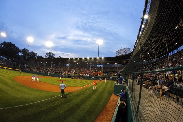 The sun sets on Lamade Stadium during a baseball game between Grosse Pointe, Mich., and Lufkin, Texas, in U.S. pool play at the Little League World Series in South Williamsport, Pa., Thursday, Aug. 17, 2017. (AP Photo/Gene J. Puskar)