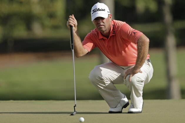 Ryan Armour lines up a putt on the ninth hole during the second round of the Wyndham Championship golf tournament in Greensboro, N.C., Friday, Aug. 18, 2017. (AP Photo/Chuck Burton)
