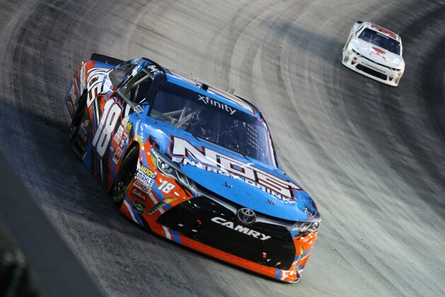 BRISTOL, TN - AUGUST 18:  Kyle Busch, driver of the #18 NOS Rowdy Toyota, leads a pack of cars during the NASCAR XFINITY Series Food City 300 at Bristol Motor Speedway on August 18, 2017 in Bristol, Tennessee.  (Photo by Jerry Markland/Getty Images)