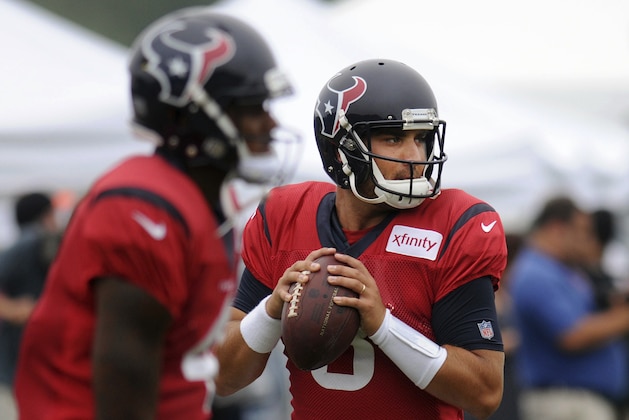 Houston Texans quarterbacks Tom Savage (3) and Deshaun Watson, left, go through drills during a joint NFL football team practice with the New England Patriots in White Sulphur Springs, W.Va., Wednesday, Aug. 16, 2017. (AP Photo/Chris Jackson)