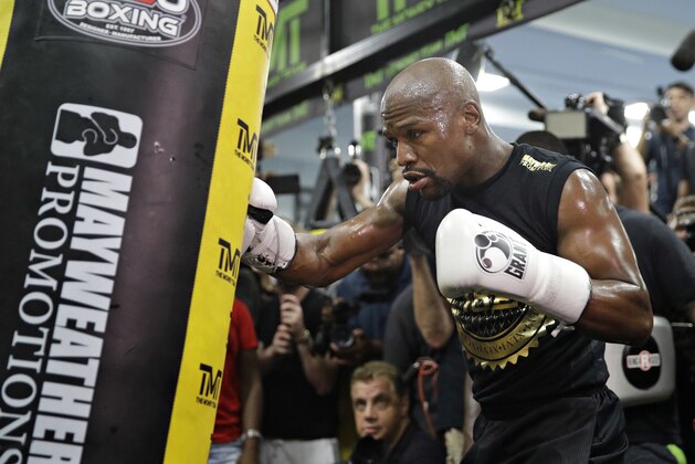 Floyd Mayweather Jr. trains at his gym while surrounded by media, Thursday, Aug. 10, 2017, in Las Vegas. Mayweather is scheduled to fight Conor McGregor on Aug. 26 in Las Vegas. (AP Photo/John Locher)