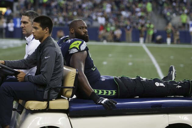 Seattle Seahawks offensive tackle George Fant is taken away on an injury cart after he went down on a play against the Minnesota Vikings in the first half of an NFL football preseason game, Friday, Aug. 18, 2017, in Seattle. (AP Photo/Scott Eklund)
