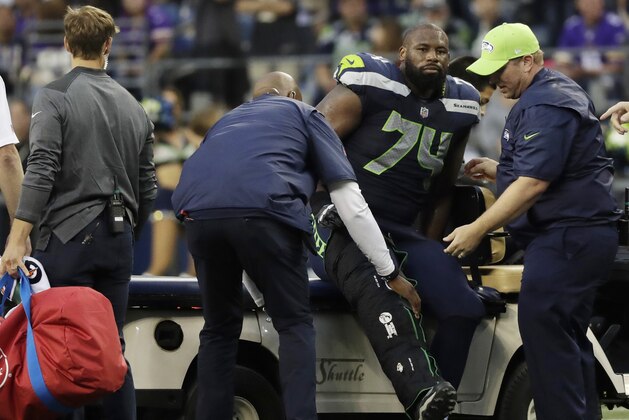 Seattle Seahawks offensive tackle George Fant is helped onto a cart after he went down on a play against the Minnesota Vikings during the first half of an NFL football preseason game, Friday, Aug. 18, 2017, in Seattle. (AP Photo/Stephen Brashear) Seattle Seahawks offensive tackle George Fant is helped onto a cart after he went down on a play against the Minnesota Vikings during the first half of an NFL football preseason game, Friday, Aug. 18, 2017, in Seattle. (AP Photo/Stephen Brashear)