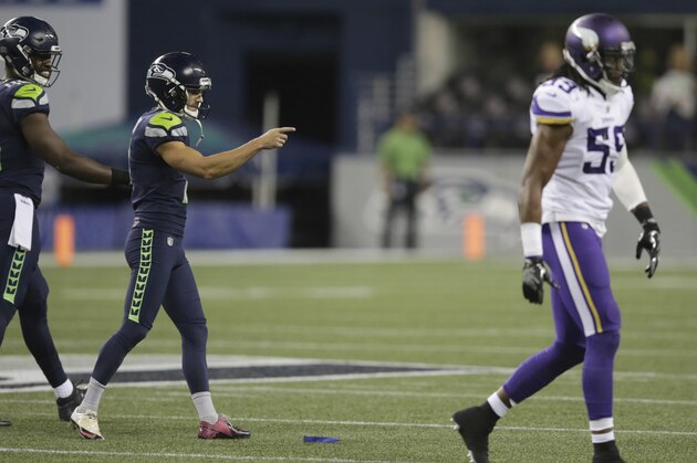 Seattle Seahawks kicker Blair Walsh, second from left, points toward the Minnesota Vikings bench after he kicked a field goal during the second half of an NFL football preseason game, Friday, Aug. 18, 2017, in Seattle. The Seahawks won 20-13. (AP Photo/Scott Eklund)