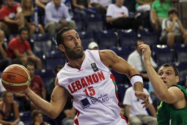 Lebanon’s Fadi El Khatib, left, drives to the basket as he is guarded by Lithuania’s Jonas Maciulis during their World Basketball Championship preliminary round match in Izmir, Turkey, Thursday Sept. 2, 2010. (AP Photo/Darko Vojinovic)