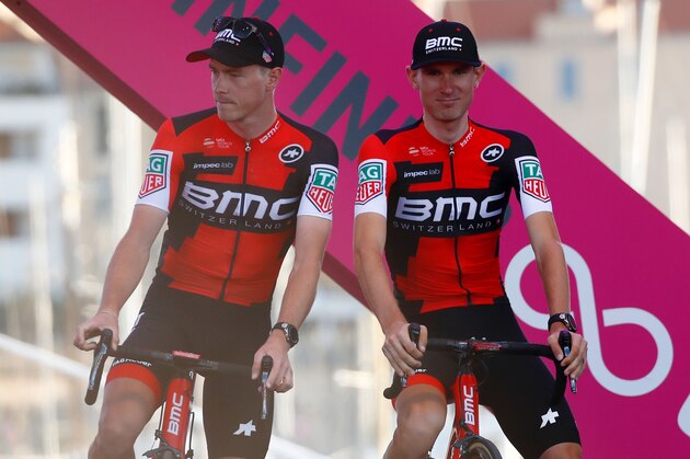 Riders of team BMC US Tejay Van Garderen (R) and Australia's Rohan Dennis stand on stage during the presentation of the teams on the eve of the 100th Giro d'Italia, Tour of Italy, on May 4, 2017 in Alghero, Italy. / AFP PHOTO / Luk BENIES        (Photo credit should read LUK BENIES/AFP/Getty Images)