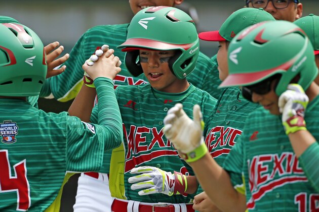Mexico's Isaac Miranda, center, celebrates with teammates after hitting a three-run home run in the second inning of an International elimination baseball game off Italy pitcher Simone Loli at the Little League World Series tournament in South Williamsport, Pa., Saturday, Aug. 19, 2017. (AP Photo/Gene J. Puskar)