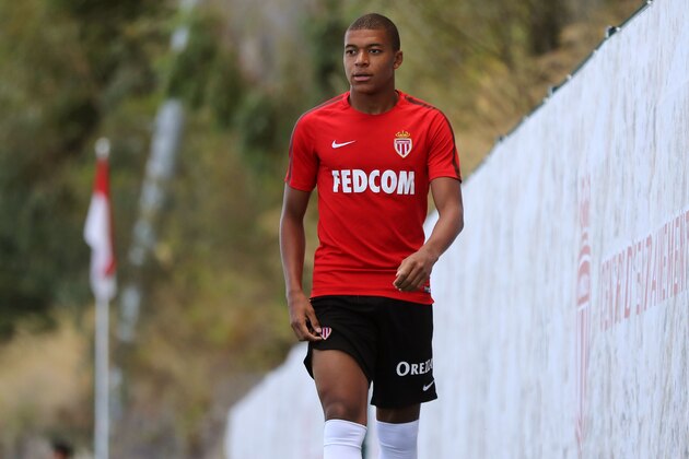 Monaco L1 football club's forward Kylian Mbappe Lottin arrives for a training session on August 11, 2017 in La Turbie, near Monaco.   / AFP PHOTO / VALERY HACHE        (Photo credit should read VALERY HACHE/AFP/Getty Images)