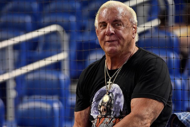 Jul 28, 2017; Miami, FL, USA; Former wrestling WCW and WWE wrestler Ric Flair warms up before throwing out the first pitch at Marlins Park prior to the game between the Cincinnati Reds and the Miami Marlins. Mandatory Credit: Jasen Vinlove-USA TODAY Sports