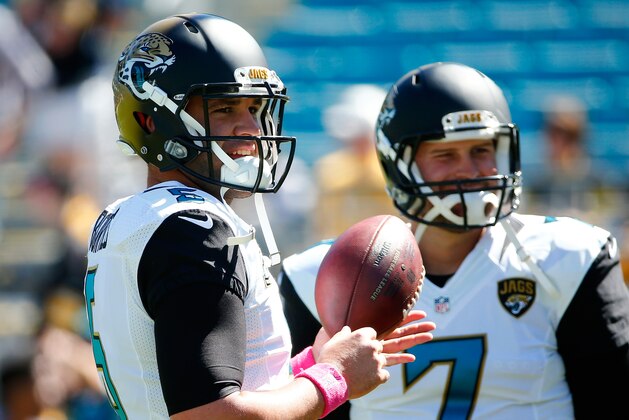JACKSONVILLE, FL - OCTOBER 05:   Blake Bortles #5 and Chad Henne #7 of the Jacksonville Jaguars warm up before the game against the Pittsburgh Steelers during the game at EverBank Field on October 5, 2014 in Jacksonville, Florida.  (Photo by Sam Greenwood/Getty Images)