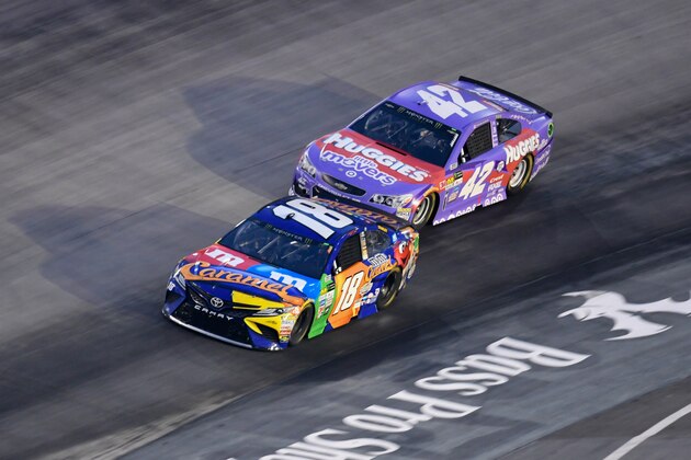 Aug 19, 2017; Bristol, TN, USA; Driver Kyle Larson (42) and Kyle Busch (18) during the Monster Energy NASCAR Cup Series Bass Pro Shops NRA Night Race at Bristol Motor Speedway. Mandatory Credit: Randy Sartin-USA TODAY Sports
