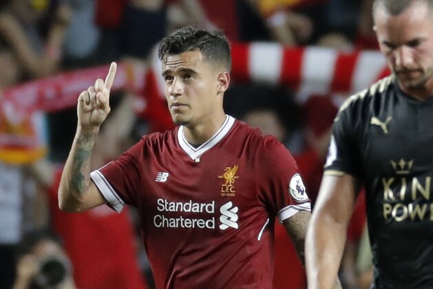 FILE - In this Saturday, July 22, 2017 file photo, Liverpool's Philippe Coutinho celebrates after scoring a goal during the final match against Leicester City FC at the Premier League Asia Trophy soccer tournament in Hong Kong. Liverpool’s American owners say Philippe Coutinho will not be sold in this transfer window, amid interest in the Brazil playmaker from Barcelona. In a short statement on Friday, Aug. 11, 2017, Fenway Sports Group say Liverpool’s “definitive stance is that no offers for Philippe will be considered.” (AP Photo/Kin Cheung, file)