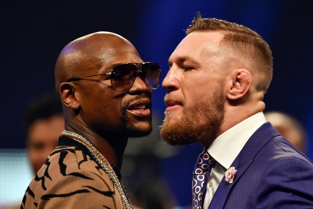 Jul 14, 2017; London, United Kingdom;  Conor McGregor and Floyd Mayweather face off during a world tour press conference to promote the upcoming Mayweather vs McGregor boxing fight at SSE Arena. Mandatory Credit: Steve Flynn-USA TODAY Sports