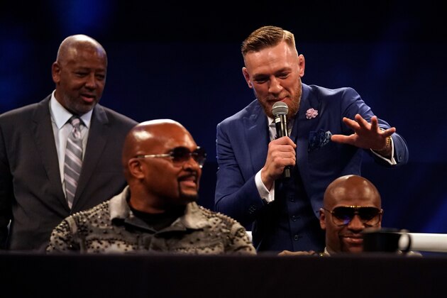 LONDON, ENGLAND - JULY 14:  Conor McGregor (R) attempts to touch the head of Floyd Mayweather Jr. during the Floyd Mayweather Jr. v Conor McGregor World Press Tour event at SSE Arena on July 14, 2017 in London, England. (Photo by Jeff Bottari/Zuffa LLC/Zuffa LLC via Getty Images)