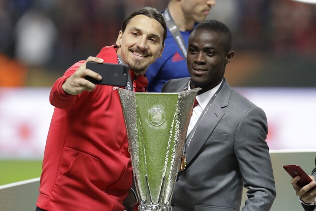 Manchester's injured player Zlatan Ibrahimovic takes a selfie after winning 2-0 during the soccer Europa League final between Ajax Amsterdam and Manchester United at the Friends Arena in Stockholm, Sweden, Wednesday, May 24, 2017. (AP Photo/Michael Sohn)