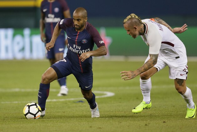DETROIT, MI - JULY 19:  Lucas Moura #7 of Paris Saint-Germain tries to break away from Radja Nainggolan #4 of AS Roma during the second half at Comerica Park on July 19, 2017 in Detroit, Michigan. (Photo by Duane Burleson/Getty Images)
