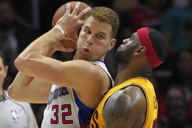 Los Angeles Clippers forward Blake Griffin, left, tries to get past Cleveland Cavaliers forward LeBron James during the second half of an NBA basketball game, Friday, Jan. 16, 2015, in Los Angeles. The Cavaliers won 126-121. (AP Photo/Mark J. Terrill)