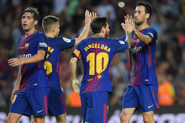Barcelona's Argentinian forward Lionel Messi (2ndR) celebrates with teammates after scoring  during the Spanish league footbal match FC Barcelona vs Real Betis at the Camp Nou stadium in Barcelona on August 20, 2017. / AFP PHOTO / LLUIS GENE        (Photo credit should read LLUIS GENE/AFP/Getty Images)