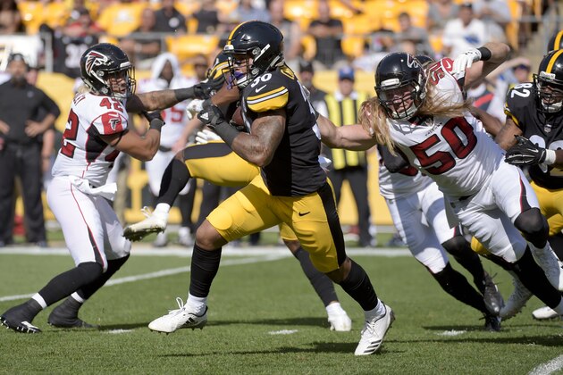 Pittsburgh Steelers running back James Conner (30) runs the ball as Atlanta Falcons defensive end Brooks Reed (50) and outside linebacker Duke Riley (42) defend in the first half of an NFL preseason football game, Sunday, Aug. 20, 2017, in Pittsburgh. (AP Photo/Fred Vuich)