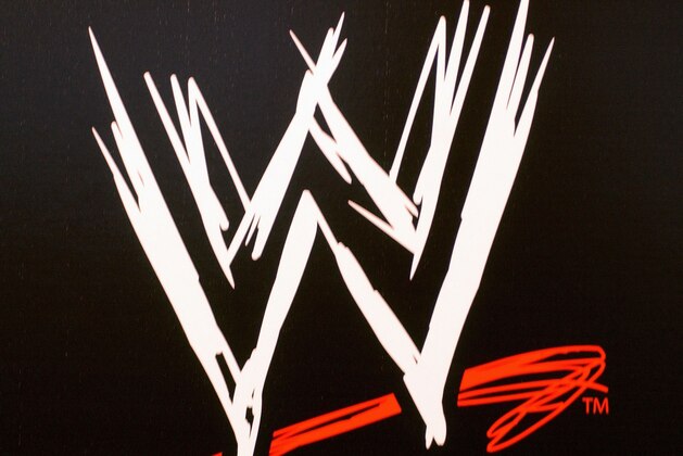 NEW YORK - MARCH 18:  The World Wrestling Entertainment logo hangs on a wall at a media conference announcing the all-star lineup of WWE WrestleMania XIX at ESPN Zone in Times Square March 18, 2003 in New York City.  (Photo by Mark Mainz/Getty Images)