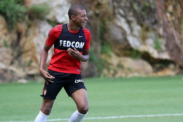 Monaco L1 football club's forward Kylian Mbappe Lottin takes part in a training session on August 11, 2017 in La Turbie, near Monaco.   / AFP PHOTO / VALERY HACHE        (Photo credit should read VALERY HACHE/AFP/Getty Images)