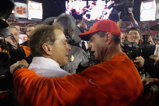 TAMPA, FL - JANUARY 09:  Head coach Nick Saban of the Alabama Crimson Tide talks with head coach Dabo Swinney of the Clemson Tigers after the Tigers defeated the Crimson Tide 35-31 in the 2017 College Football Playoff National Championship Game at Raymond James Stadium on January 9, 2017 in Tampa, Florida.  (Photo by Streeter Lecka/Getty Images)