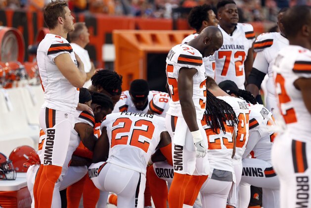 Members of the Cleveland Browns kneel during the national anthem before an NFL preseason football game between the New York Giants and the Cleveland Browns, Monday, Aug. 21, 2017, in Cleveland. (AP Photo/Ron Schwane)
