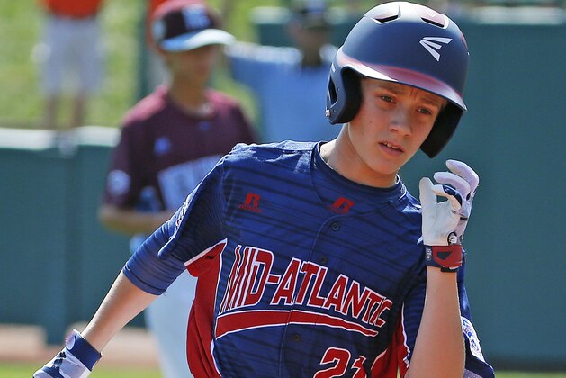 Jackson, N.J.'s Tai Mann (21) rounds the bases after hitting a solo-home run off Fairfield, Conn., pitcher Ethan Righter in the first inning of a baseball game in United States pool play at the Little League World Series tournament in South Williamsport, Pa., Thursday, Aug. 17, 2017. (AP Photo/Gene J. Puskar)
