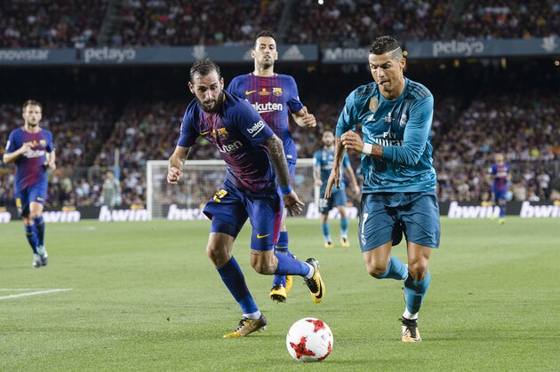 BARCELONA, SPAIN - AUGUST 13: Cristiano Ronaldo of Real Madrid (R) in action against Aleix Vidal of FC Barcelona (L) during the Supercopa de Espana Final 1st Leg match between FC Barcelona and Real Madrid at Camp Nou on August 13, 2017 in Barcelona, Spain. (Photo by Marcio Rodrigo Machado/Power Sport Images/Getty Images,) BARCELONA, SPAIN - AUGUST 13: Cristiano Ronaldo of Real Madrid (R) in action against Aleix Vidal of FC Barcelona (L) during the Supercopa de Espana Final 1st Leg match between FC Barcelona and Real Madrid at Camp Nou on August 13, 2017 in Barcelona, Spain. (Photo by Marcio Rodrigo Machado/Power Sport Images/Getty Images,)