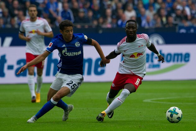 GELSENKIRCHEN, GERMANY - AUGUST 19: Amine Harit of Schalke and Naby Keita of Leipzig battle for the ball during the Bundesliga match between FC Schalke 04 and RB Leipzig at Veltins-Arena on August 19, 2017 in Gelsenkirchen, Germany. (Photo by TF-Images/TF-Images via Getty Images)