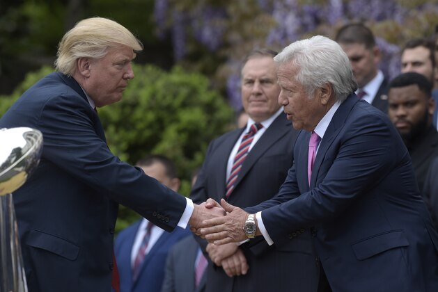 President Donald Trump shakes hands with New England Patriots owner Robert Kraft, accompanied by head coach Bill Belichick, center, during a ceremony on the South Lawn of the White House in Washington, Wednesday, April 19, 2017, where the president honored the Super Bowl Champion New England Patriots for their Super Bowl LI victory.. (AP Photo/Susan Walsh)