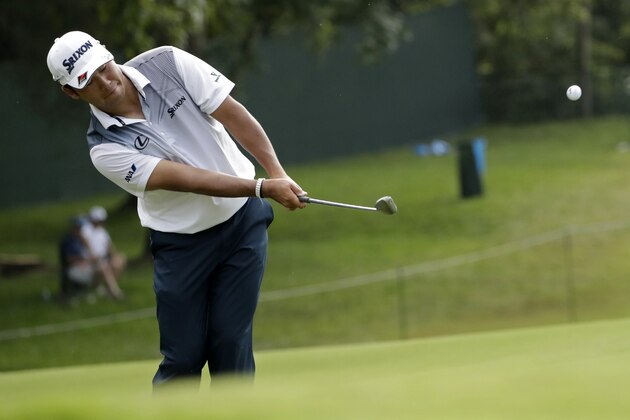 Hideki Matsuyama of Japan, chips to the 13th green during the final round of the PGA Championship golf tournament at the Quail Hollow Club Sunday, Aug. 13, 2017, in Charlotte, N.C. (AP Photo/John Bazemore)