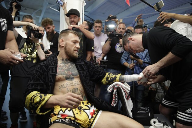 Conor McGregor has his hands wrapped before a media workout Friday, Aug. 11, 2017, in Las Vegas. McGregor is scheduled to fight Floyd Mayweather Jr. in a boxing match Aug. 26 in Las Vegas. (AP Photo/John Locher)