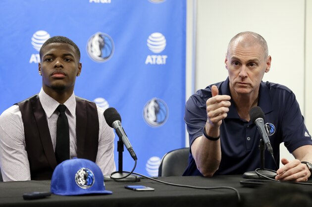 Dallas Mavericks 2017 NBA basketball first-round selectee, Dennis Smith Jr., listens as head coach Rick Carlisle, right, makes comments during a news conference, Friday, June 23, 2017, in Dallas. (AP Photo/Tony Gutierrez)