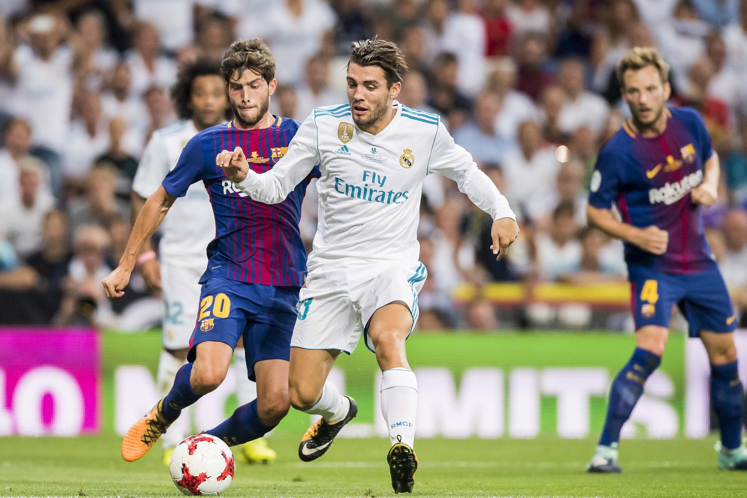MADRID, SPAIN - AUGUST 16 - Mateo Kovacic (r) of Real Madrid battles for the ball with Sergi Roberto Carnicer of FC Barcelona during their Supercopa de Espana Final 2nd Leg match between Real Madrid and FC Barcelona at the Estadio Santiago Bernabeu on 16 August 2017 in Madrid, Spain. (Photo by Power Sport Images/Getty Images)