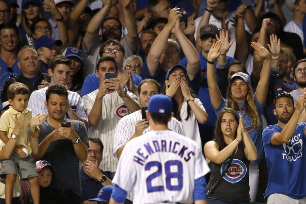 Fans applaud Chicago Cubs starting pitcher Kyle Hendricks as he leaves the baseball game during the seventh inning against the Cincinnati Reds Tuesday, Aug. 15, 2017, in Chicago. (AP Photo/Charles Rex Arbogast) Fans applaud Chicago Cubs starting pitcher Kyle Hendricks as he leaves the baseball game during the seventh inning against the Cincinnati Reds Tuesday, Aug. 15, 2017, in Chicago. (AP Photo/Charles Rex Arbogast)