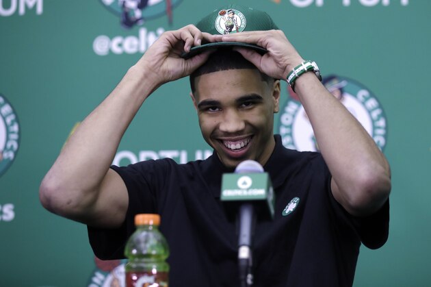 FILE - This June 23, 2017 file photo shows Boston Celtics first-round draft pick Jayson Tatum at the team's practice facility in Waltham, Mass. NBA Summer League rosters are typically full of rookies getting their first taste of the league or other players young in their career trying to catch on with a roster. The Utah Summer League will open with the most anticipated game of the three-day session. The 76ers and No. 1 pick Markelle Fultz face Tatum and the Celtics in the first game Monday. (AP Photo/Charles Krupa, file)