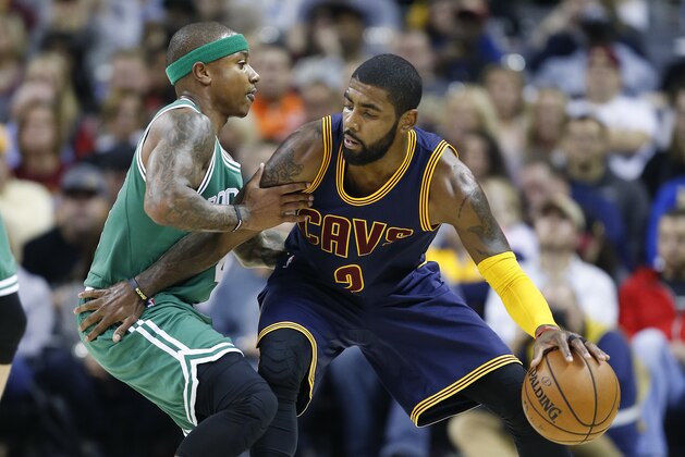Cleveland Cavaliers' Kyrie Irving (2) looks to drive against Boston Celtics' Isaiah Thomas (4) during the first half of an NBA basketball game Thursday, Nov. 3, 2016, in Cleveland. (AP Photo/Ron Schwane)