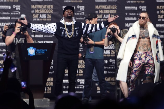Floyd Mayweather Jr., front left, poses as Conor McGregor, right, watches during a news conference at Barclays Center on Thursday, July 13, 2017, in New York, for their junior middleweight boxing bout next month. (AP Photo/Frank Franklin II) Floyd Mayweather Jr., front left, poses as Conor McGregor, right, watches during a news conference at Barclays Center on Thursday, July 13, 2017, in New York, for their junior middleweight boxing bout next month. (AP Photo/Frank Franklin II)