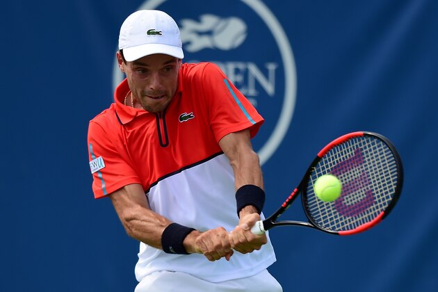 WINSTON-SALEM, NC - AUGUST 22:  Roberto Bautista Agut of Spain returns a shot from Dusan Lajovic of Serbia during the fourth day of the Winston-Salem Open at Wake Forest University on August 22, 2017 in Winston-Salem, North Carolina.  (Photo by Jared C. Tilton/Getty Images)