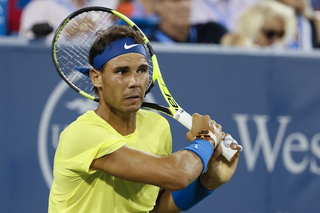 Rafael Nadal, of Spain, returns to Nick Kyrgios, of Australia, at the Western & Southern Open tennis tournament, Friday, Aug. 18, 2017, in Mason, Ohio. (AP Photo/John Minchillo) Rafael Nadal, of Spain, returns to Nick Kyrgios, of Australia, at the Western & Southern Open tennis tournament, Friday, Aug. 18, 2017, in Mason, Ohio. (AP Photo/John Minchillo)