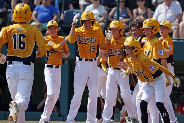 Greenville, N.C.'s Carson Hardee (16) trots home to his teammate's celebration after hitting a grand slam off Rancho Santa Margarita, Calif., pitcher Drew Rutter in the second inning of a baseball game in United States pool play at the Little League World Series tournament in South Williamsport, Pa., Sunday, Aug. 20, 2017. North Carolina won 16-0. (AP Photo/Gene J. Puskar)