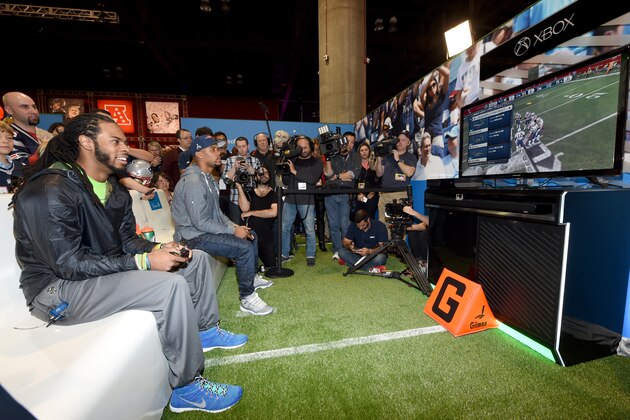 PHOENIX, AZ - JANUARY 27:  Seattle Seahawks cornerback Richard Sherman (L) and New England Patriots running back Shane Vereen square off in 'Madden NFL 15' for Microsoft's Game Before the Game on Xbox One Super Bowl Edition at the Phoenix Convention Center on January 27, 2015 in Phoenix, Arizona.  (Photo by Ethan Miller/Getty Images for Microsoft)