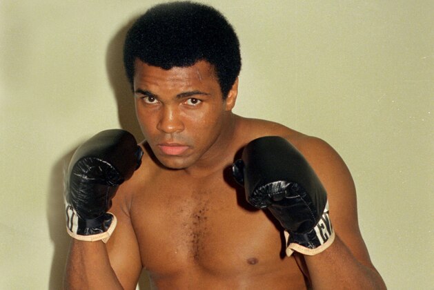 FILE - This is an Oct. 9, 1974, file photo showing Muhammad Ali.  Ali, the magnificent heavyweight champion whose fast fists and irrepressible personality transcended sports and captivated the world, has died according to a statement released by his family Friday, June 3, 2016. He was 74.(AP Photo)