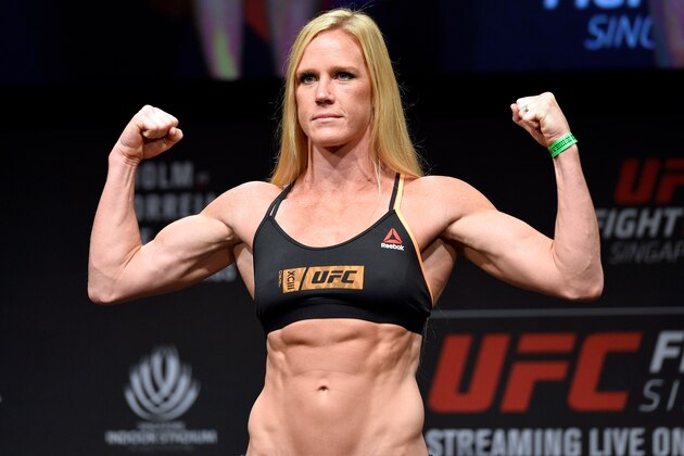 SINGAPORE - JUNE 16:  Holly Holm of the United States poses on the scale during the UFC Fight Night weigh-in at the Marina Bay Sands on June 16, 2017 in Singapore. (Photo by Brandon Magnus/Zuffa LLC/Zuffa LLC via Getty Images)