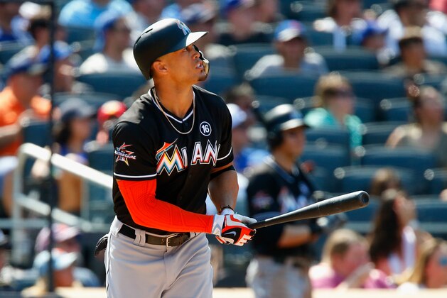 NEW YORK, NY - AUGUST 20:  Giancarlo Stanton #27 of the Miami Marlins watches the flight of his seventh inning three run home run against the New York Mets at Citi Field on August 20, 2017 in the Flushing neighborhood of the Queens borough of New York City.  (Photo by Jim McIsaac/Getty Images)