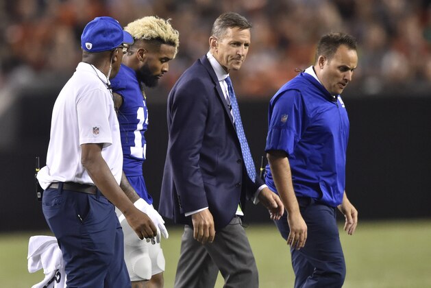 New York Giants wide receiver Odell Beckham , second from left, walks to the sideline after injuring his ankle in the first half of an NFL preseason football game against the Cleveland Browns, Monday, Aug. 21, 2017, in Cleveland. The Browns won 10-6. (AP Photo/David Richard)