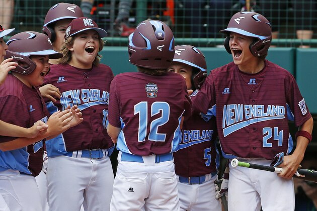 Fairfield, Conn.'s Troy Ashkinos (12) is greeted by teammates as he crosses home plate after hitting a grand slam off Jackson, N.J. pitcher Tai Mann in the fourth inning of an elimination baseball game in United States pool play at the Little League World Series tournament in South Williamsport, Pa., Wednesday, Aug. 23, 2017. Connecticut won 12-2. (AP Photo/Gene J. Puskar)