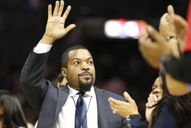 BIG3 Basketball League founder Ice Cube waves as he is introduced to the crowd during the new basketball league's debut, Sunday, June 25, 2017, at the Barclays Center in New York. (AP Photo/Kathy Willens)